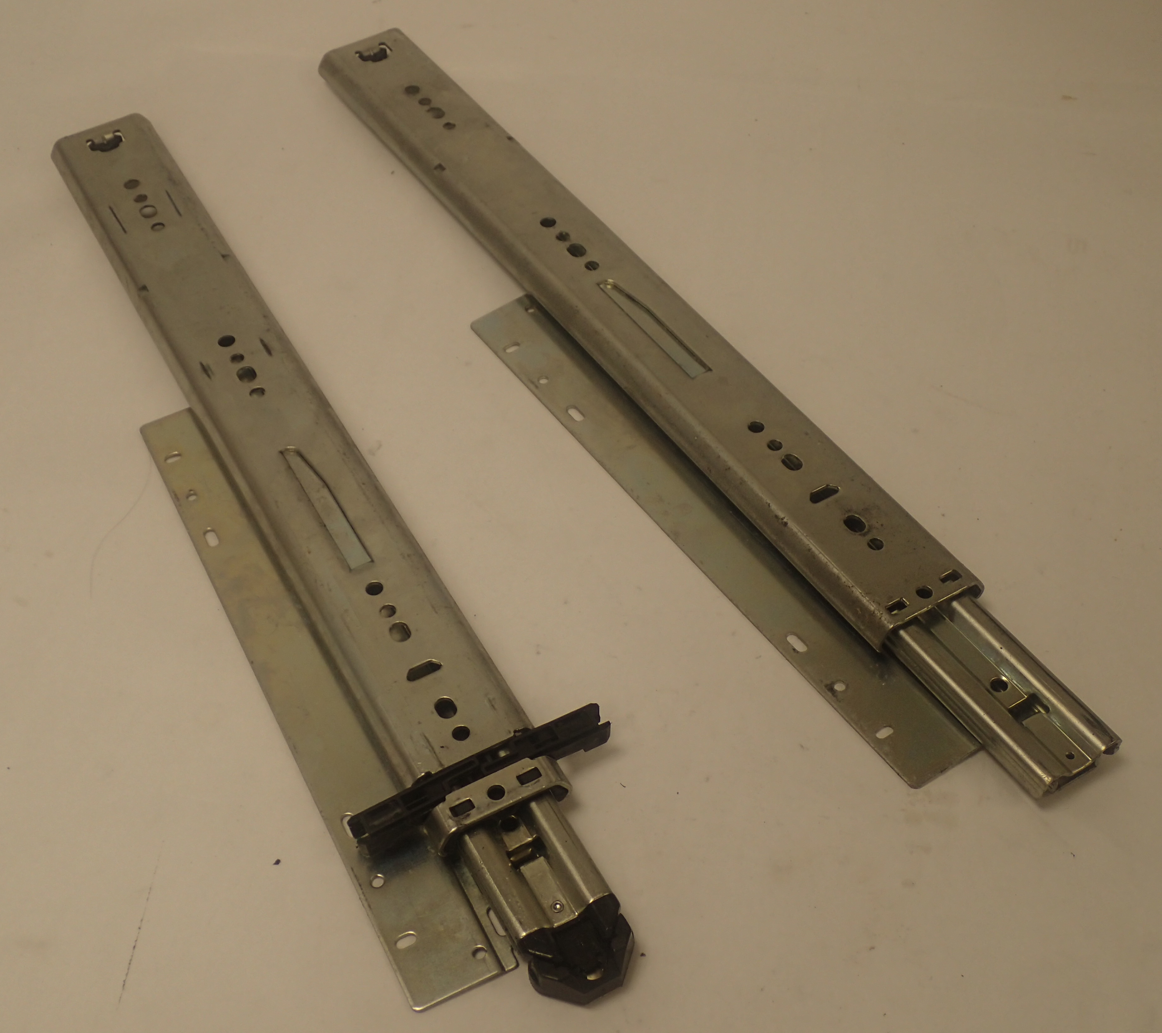 Accuride ball-bearing telescopic drawer slide with a soft sequencing latch sold per pair.